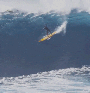 A surfer falling during a takeoff, illustrating the importance of committing fully to challenges and standing up into fear, as emphasized by Naomi Gleit